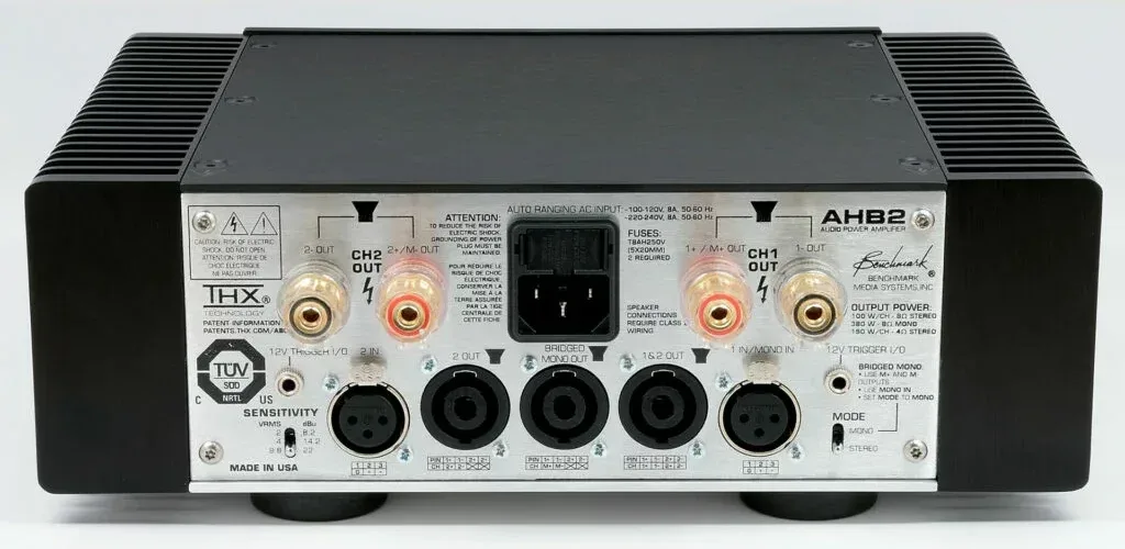Benchmark AHB2 amplifier front panel, black chassis with silver faceplate showing dual channel outputs and XLR inputs