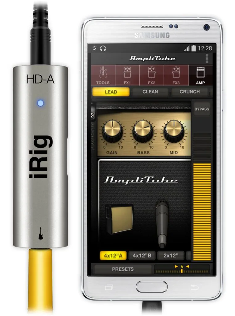 iRig HD-A silver audio interface with 3.5mm jack next to Samsung phone running AmpliTube app with guitar amp controls