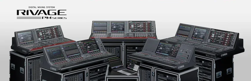 Yamaha RIVAGE PM series digital mixing consoles arranged in a symmetrical studio setup against white background