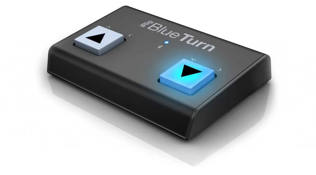 iRig BlueTurn wireless page turner with two black triangle buttons on dark case, blue button illuminated