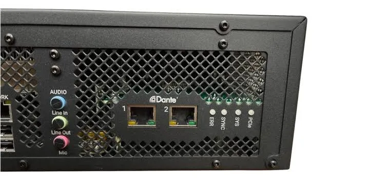 Waves SuperRack LiveBox rear panel showing Dante network ports, audio I/O connectors, and metal mesh ventilation at angle