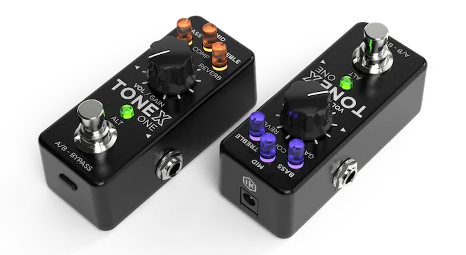 Two black guitar effect pedals side-by-side: TONEX ONE on left with orange knobs, TONEX on right with purple buttons and controls