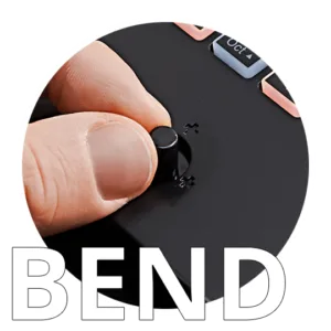 Finger pressing black Nektar Impact GX Mini pad controller, showing compact size and tactile surface detail