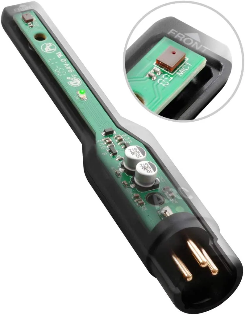ARC Measurement Mic handheld device with green circuit board visible, two white cylindrical components, gold connectors at base, angled view