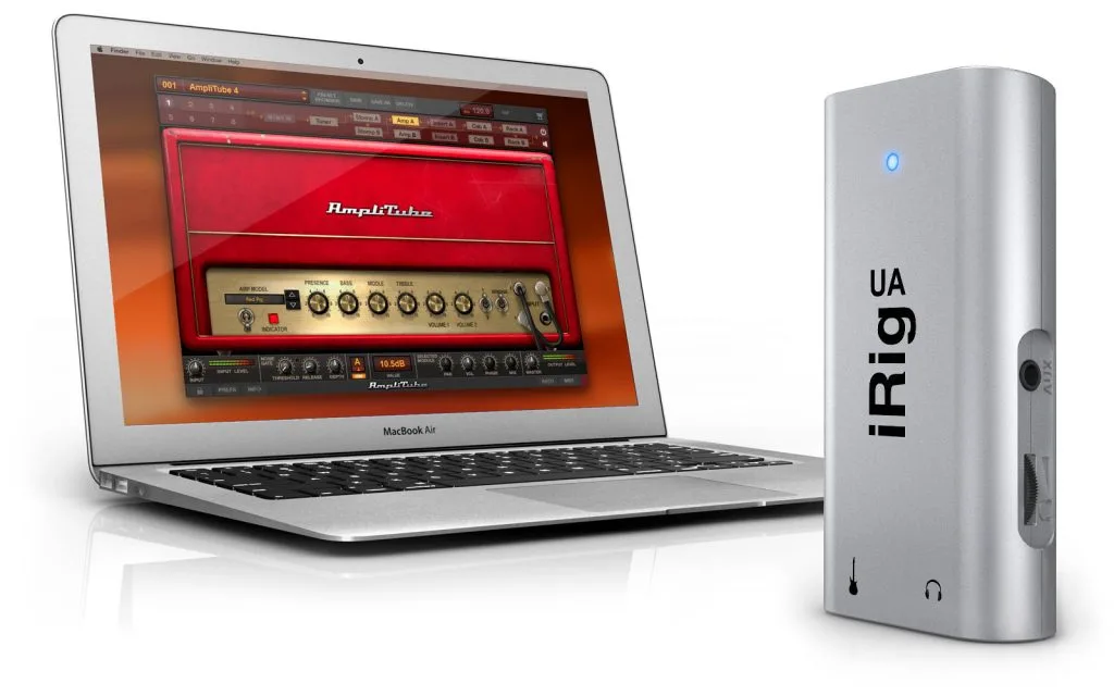 Silver iRig UA audio interface displayed next to MacBook Air showing AmpliTube software with red amplifier plugin