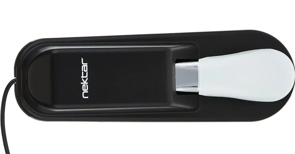 Nektar NP-2 sustain pedal, black housing with white footplate, shown from above against white background