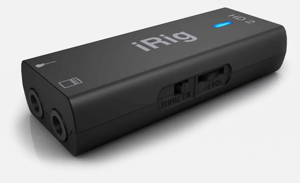 Black iRig HD2 audio interface shown at angle, displaying dual 1/4-inch inputs and control knobs on right side