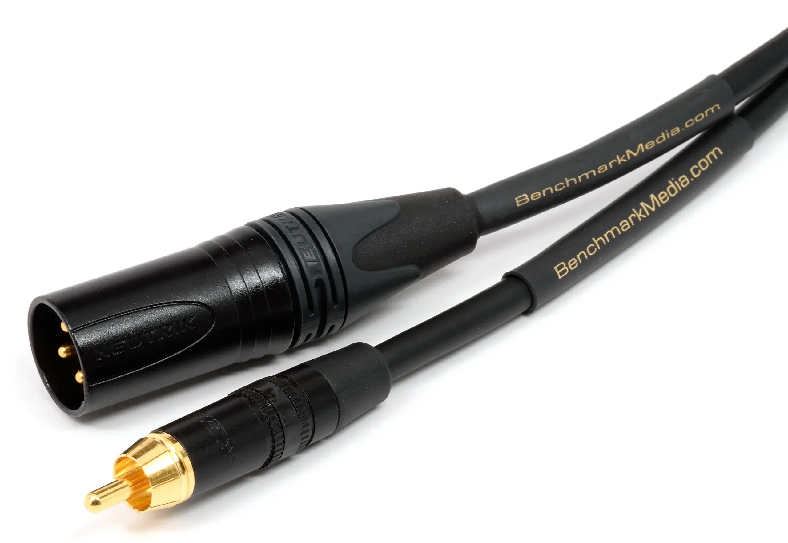 Benchmark RCA-XLRm cable on white background showing gold RCA connector and black XLR male connector with gold-plated pins