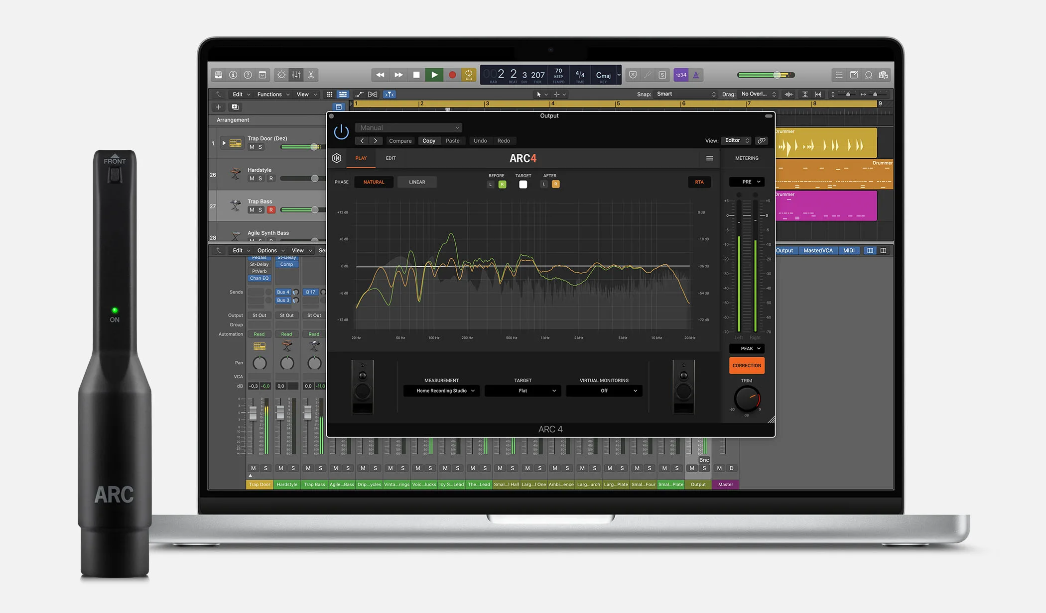 IK Multimedia ARC 4 acoustic measurement microphone positioned vertically next to monitor displaying ARC 4 software interface