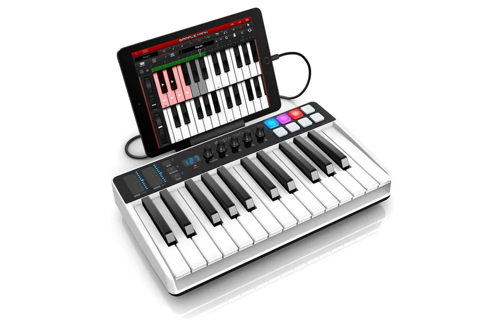 iRig Keys I/O keyboard controller with a tablet in its built-in stand