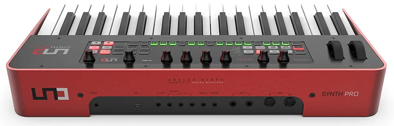 Red Uno Synth Pro synthesizer with keyboard and control panel, rear view showing audio connections