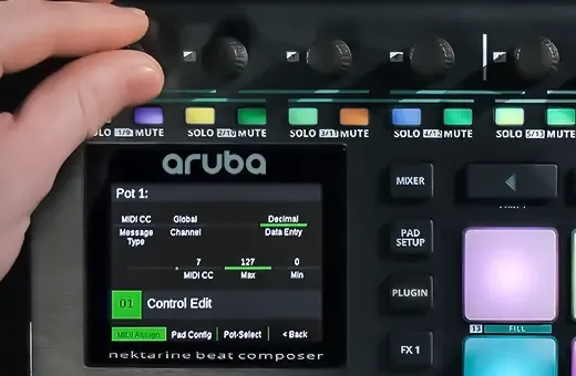 Nektar Aruba controller displayed at angle, showing screen menu, pad grid, and mixer controls with hand adjusting knob