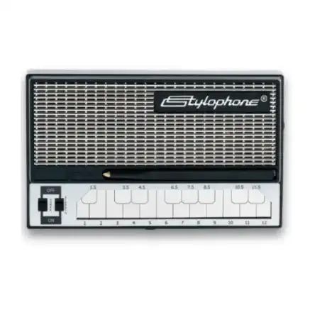 Stylophone S-1 portable synthesizer, black and white, front-facing view showing speaker grille and numbered keys on white background